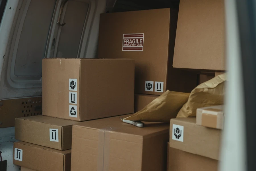 Parcels stacked inside the back of a delivery van