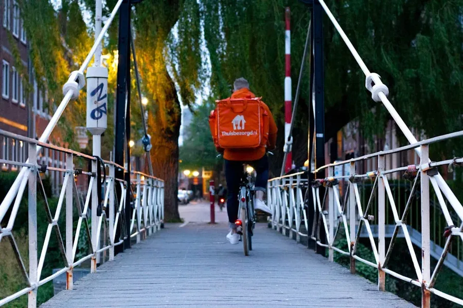 Bike Courier on a Bridge