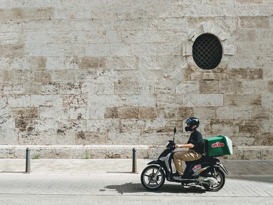 delivery driver on a scooter