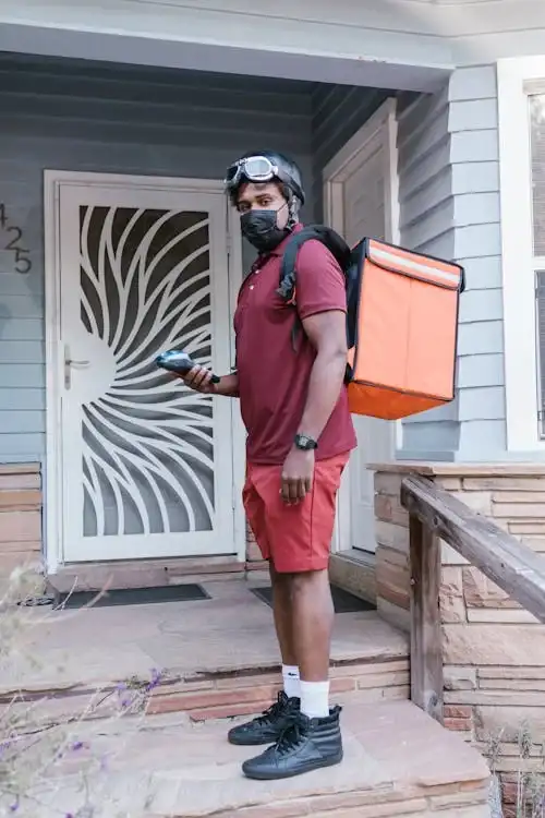 A Just Eat courier carrying an insulated delivery bag
