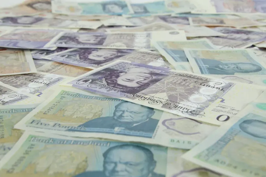 Spread of Bank of England banknotes including five and twenty pound notes
