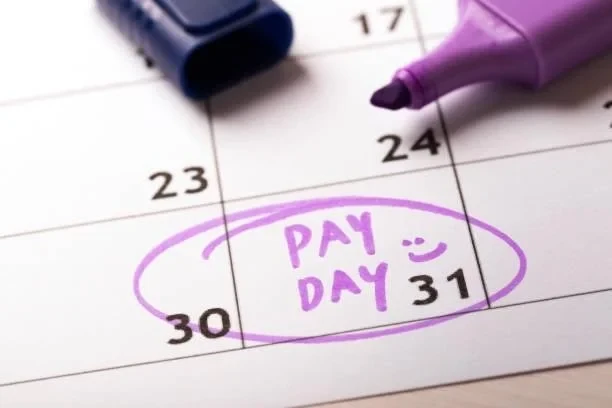 Calendar page with pay day circled in marker