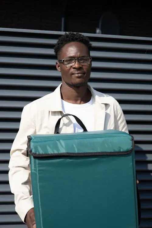 A Man Holding a Delivery Bag