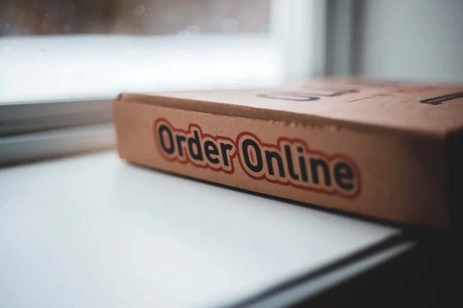 Takeaway pizza box printed with the words Order Online