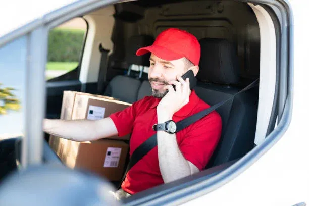 What is a Multi Drop Delivery Driver? - close up of checking a package using portable information device picture