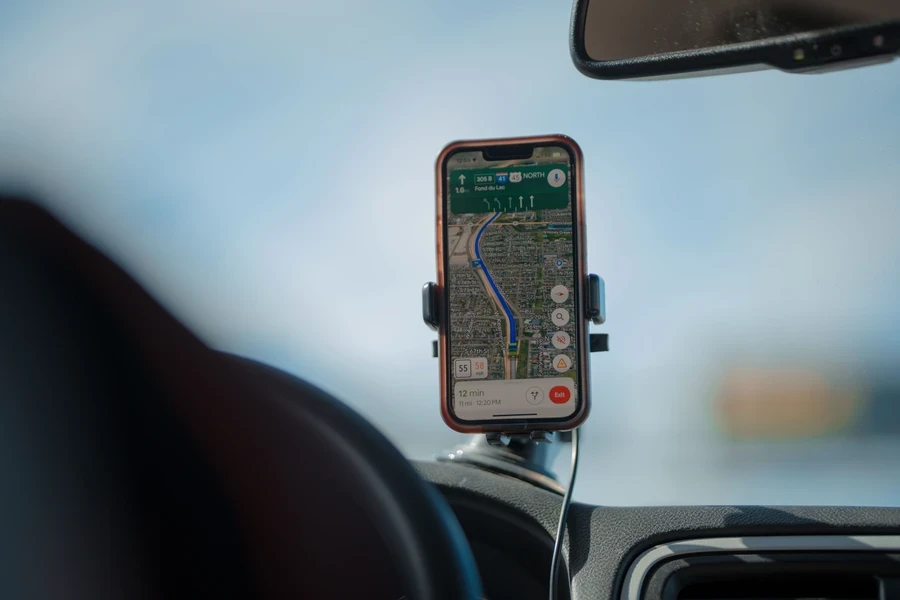 Sat nav route shown on a phone mounted to a van dashboard