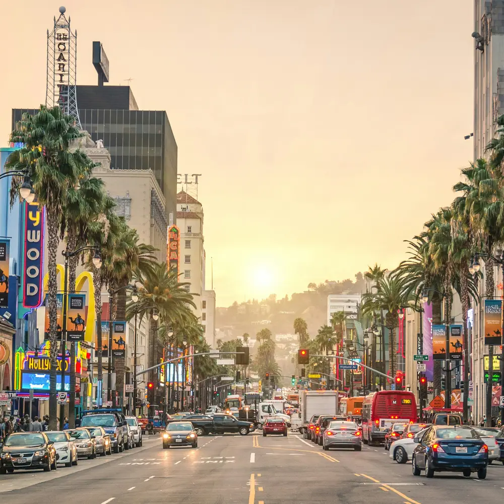 Hollywood Boulevard in Los Angeles at sunset, traffic moving in both directions